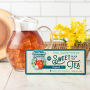 Southern Breeze Original Sweet Iced Tea 22ct family size alongside a pitcher of iced tea
