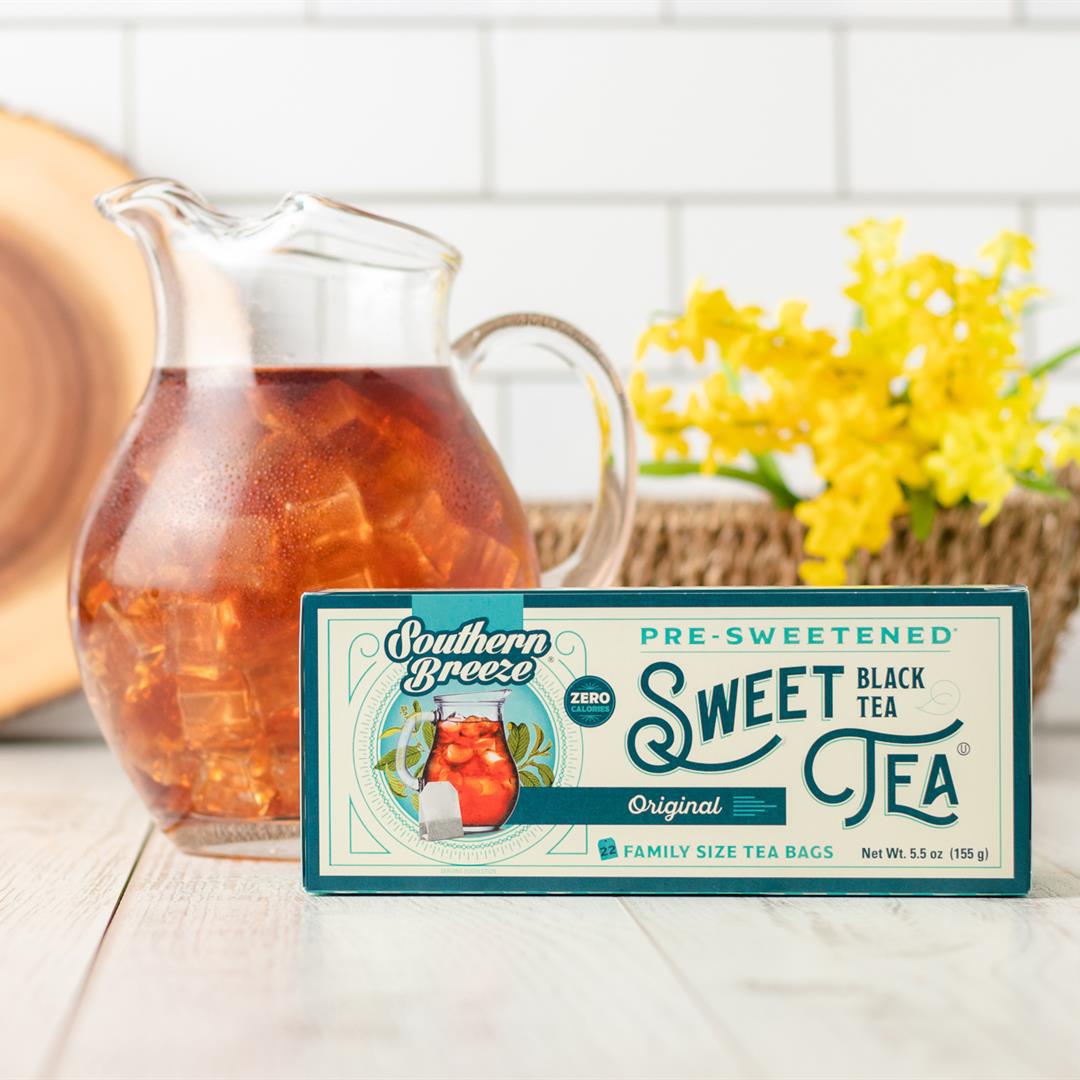 Southern Breeze Original Sweet Iced Tea 22ct family size alongside a pitcher of iced tea