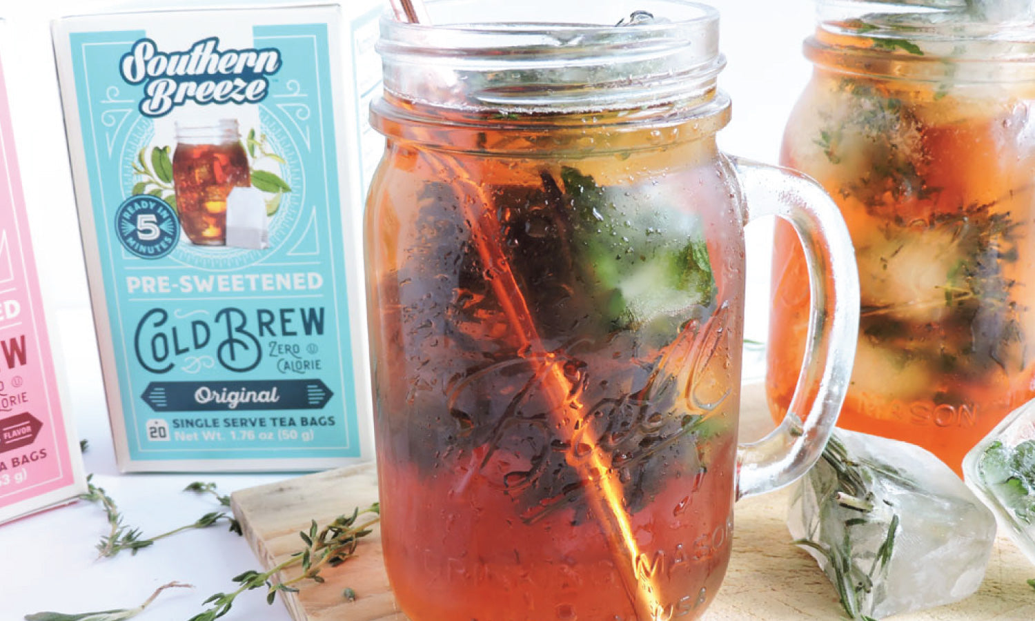 Simple Herb Infused Ice Cubes in a mason jar alongside Southern Breeze Original Sweet Tea