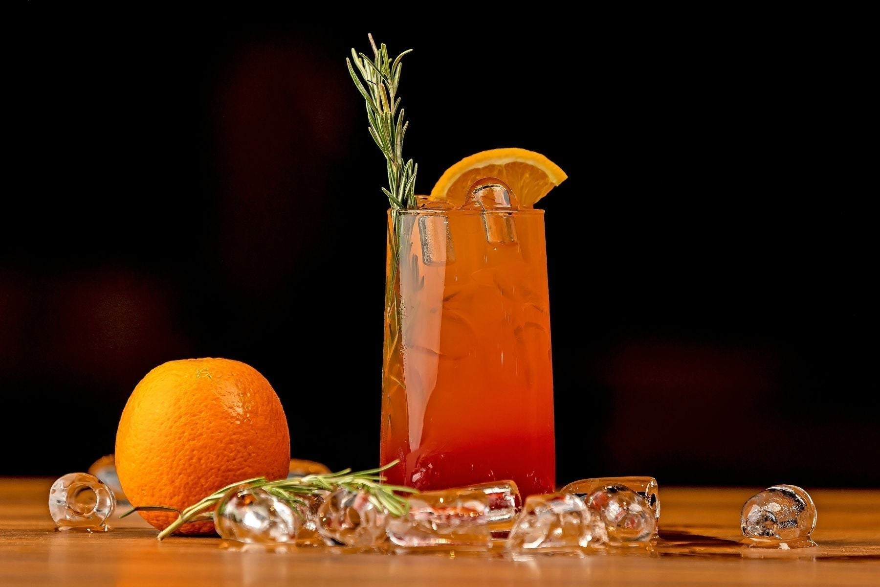 Southern Spiked Blood Orange Cocktail garnished with rosemary and an orange slice.