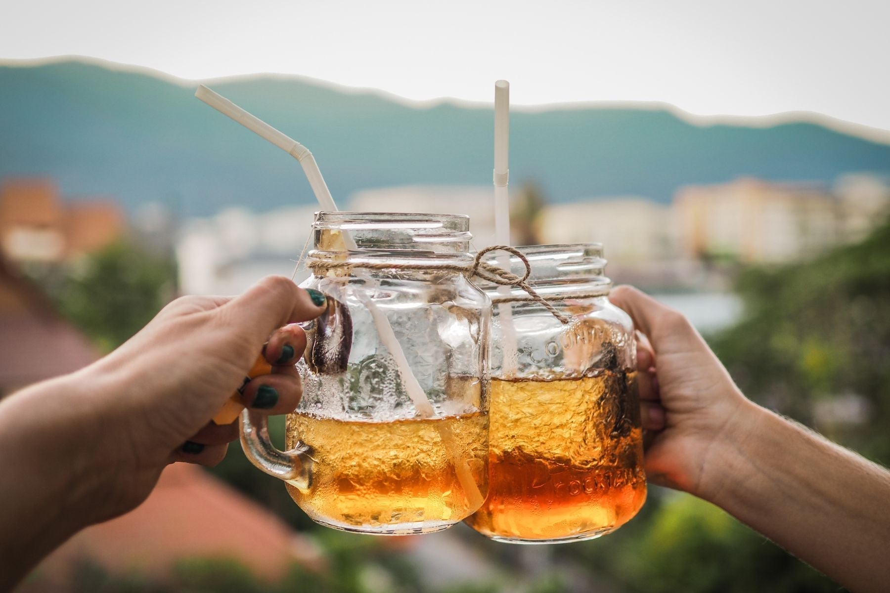 Two Iced Tea Mason Jars clinking
