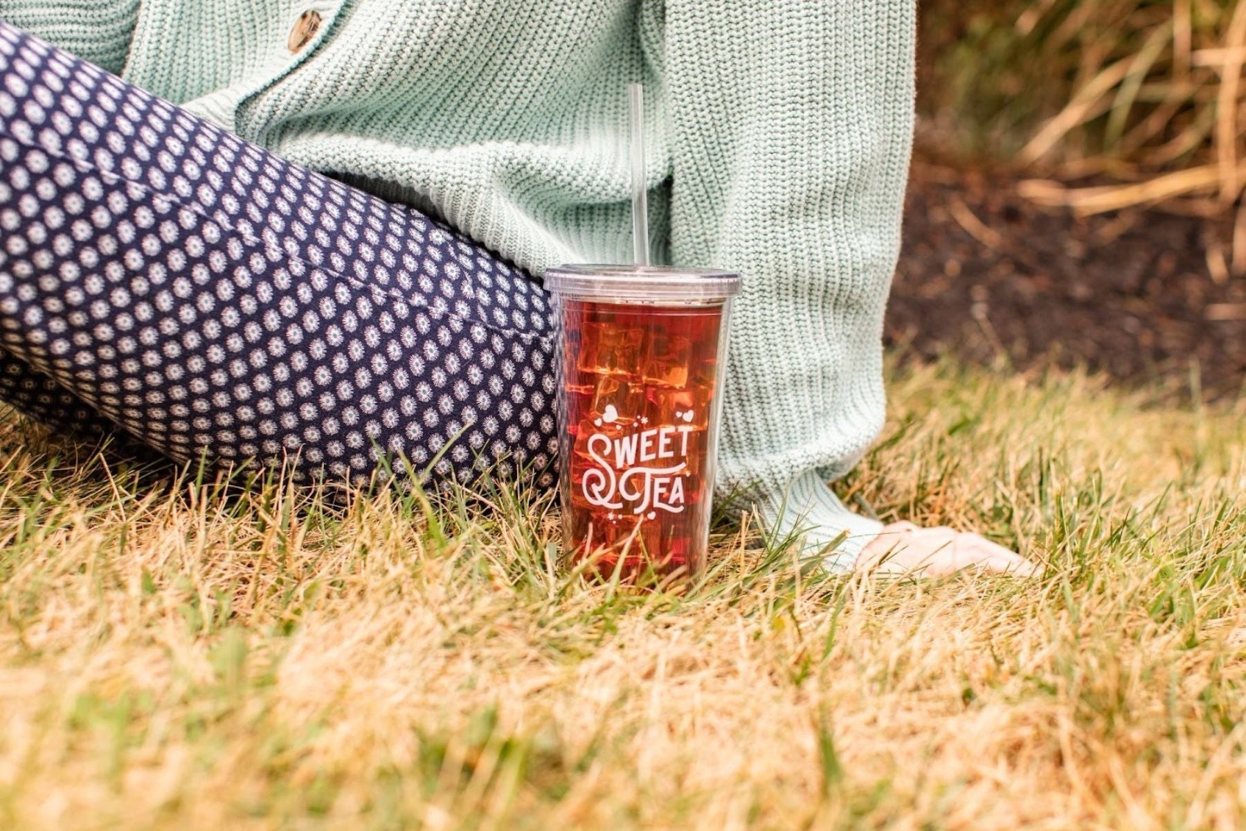 Person seated beside a glass of Southern Breeze iced tea