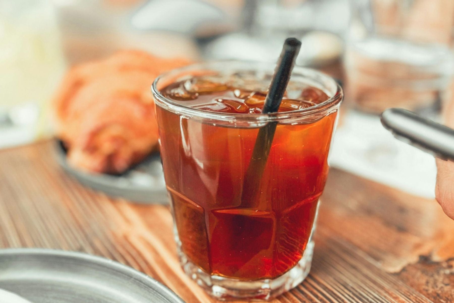 Glass of iced tea served with a straw
