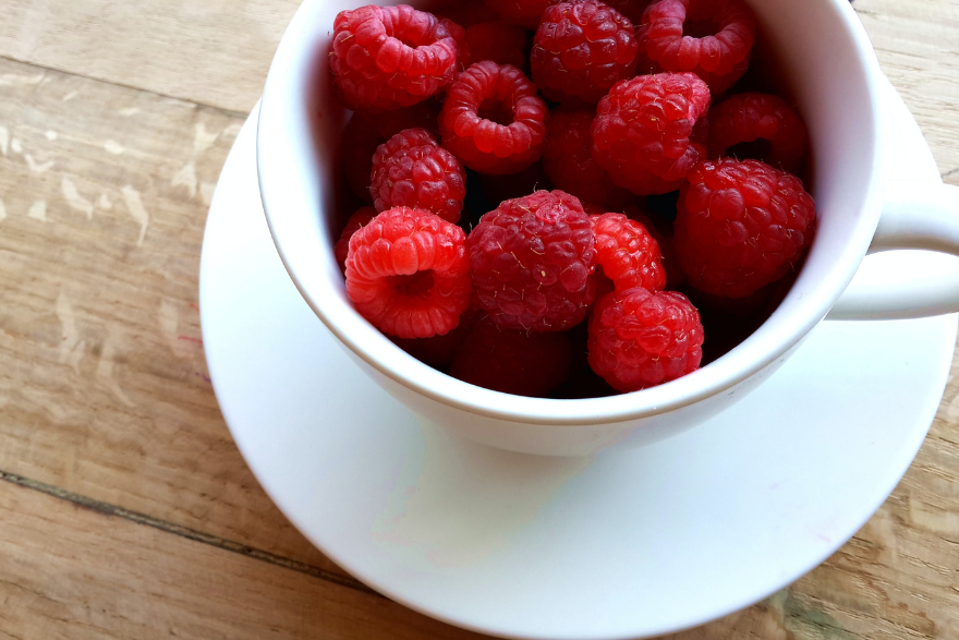 berries in a white tea cup