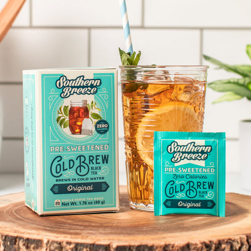 Southern Breeze pre-sweetened cold brew black tea packaging with a glass of iced tea on a wooden surface.