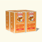 Four boxes of Southern Breeze pre-sweetened cold brew black tea with mango flavor on a white background.