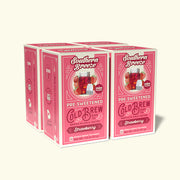 Four boxes of Southern Breeze strawberry pre-sweetened cold brew tea bags on a white background