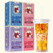 Four Southern Breeze Cold Brew tea boxes in blue, pink, and purple flavors  - Blackberry, Raspberry, Strawberry & Blueberry flavor -  shown next to a clear plastic cup filled with iced tea and ice on a light cream background.
