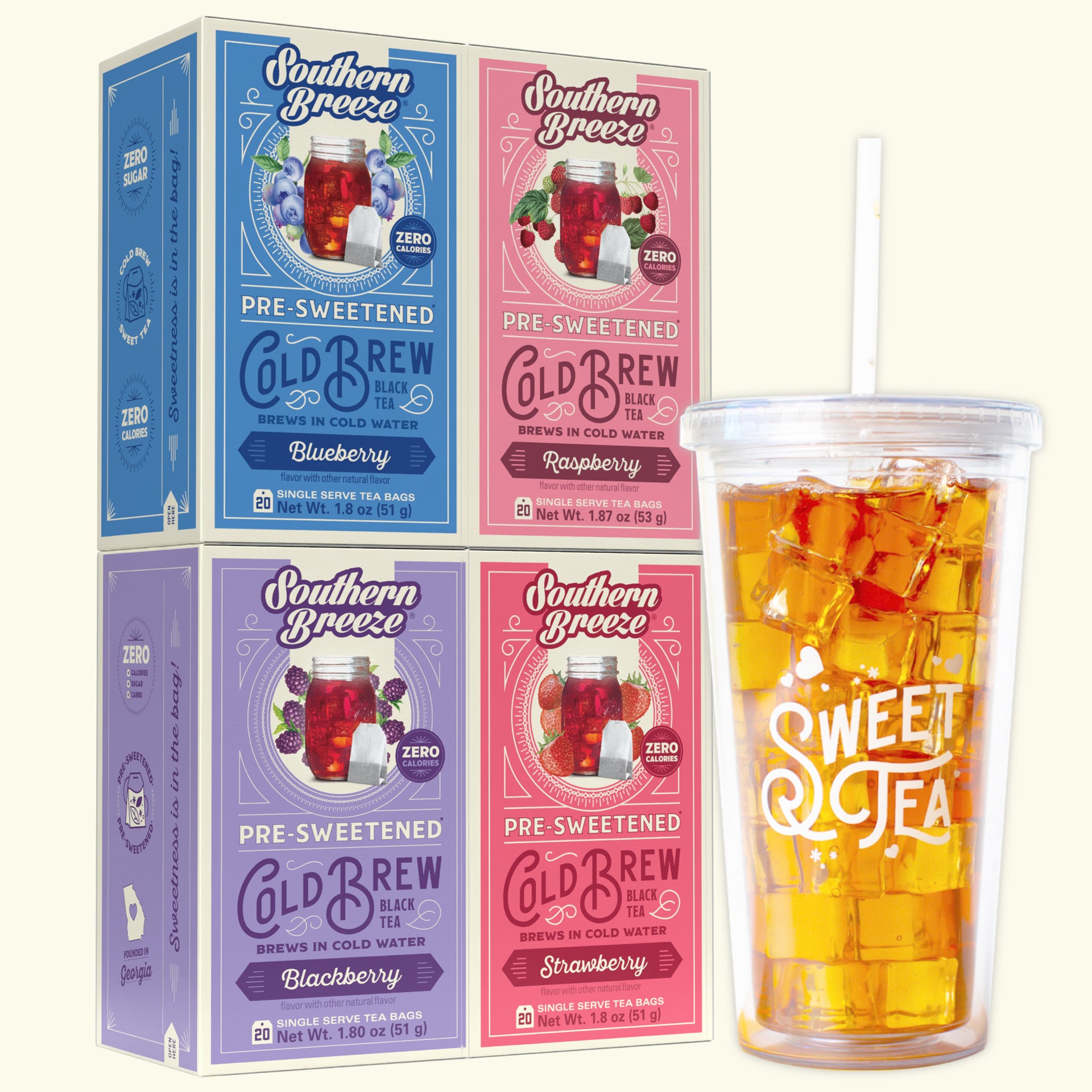 Four Southern Breeze Cold Brew tea boxes in blue, pink, and purple flavors  - Blackberry, Raspberry, Strawberry & Blueberry flavor -  shown next to a clear plastic cup filled with iced tea and ice on a light cream background.
