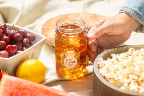 mason jar with handle that reads life needs more sweet tea